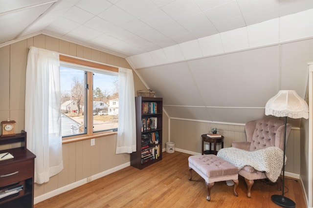 49 Morgan St, Burlington, VT 05408 - living area featuring wood finished floors, lofted ceiling, baseboards, and wood walls