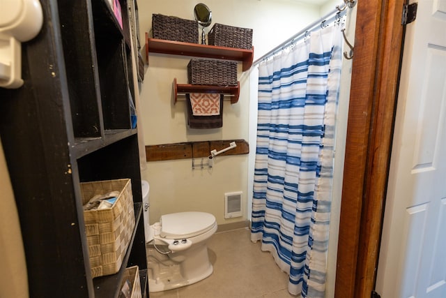 18 State St, Northumberland, NH 03582 - bathroom featuring toilet, tile patterned flooring, heating unit, and a shower with curtain