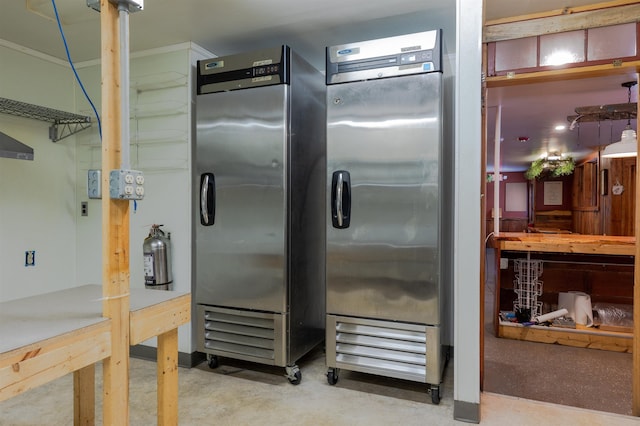 18 State St, Northumberland, NH 03582 - kitchen with stainless steel fridge and concrete floors