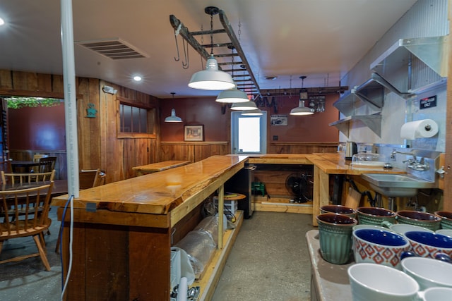 18 State St, Northumberland, NH 03582 - bar with wooden walls, a wainscoted wall, a sink, and hanging light fixtures
