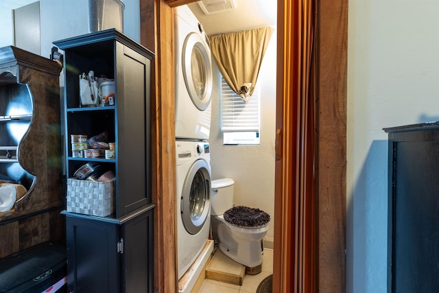 18 State St, Northumberland, NH 03582 - laundry room with stacked washer / drying machine and light tile patterned floors