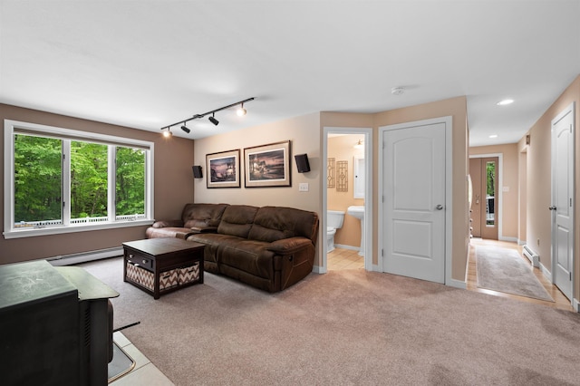 11 Sledding Hill Ln, Lee, NH 03861 - living room featuring baseboard heating, light colored carpet, recessed lighting, and baseboards