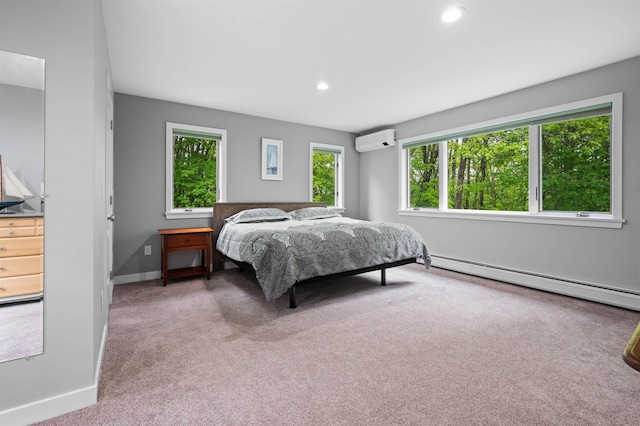 11 Sledding Hill Ln, Lee, NH 03861 - carpeted bedroom with a wall unit AC, baseboard heating, baseboards, and recessed lighting
