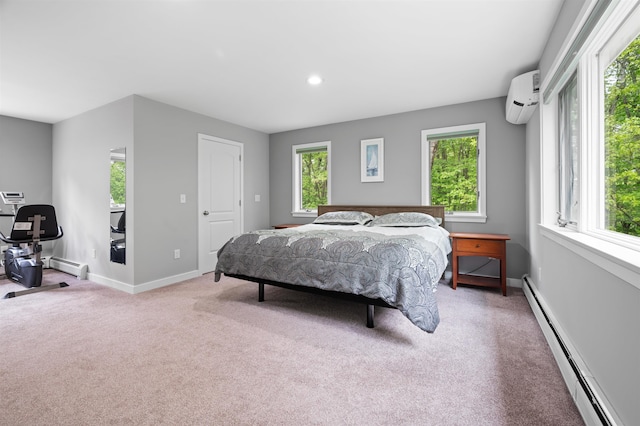 11 Sledding Hill Ln, Lee, NH 03861 - bedroom featuring a baseboard radiator, a wall mounted AC, light carpet, baseboards, and recessed lighting