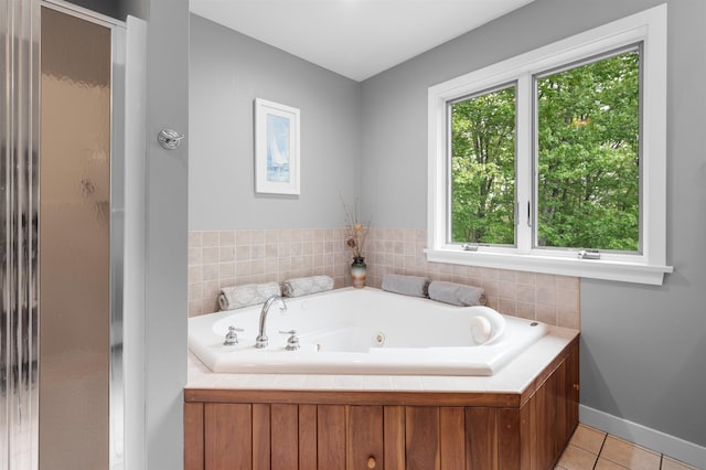 11 Sledding Hill Ln, Lee, NH 03861 - bathroom featuring a tub with jets, tile patterned floors, baseboards, and a shower with door