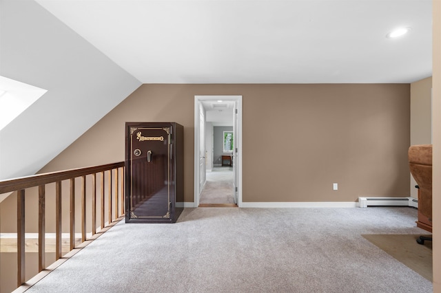 11 Sledding Hill Ln, Lee, NH 03861 - additional living space featuring baseboard heating, carpet, vaulted ceiling, recessed lighting, and a skylight