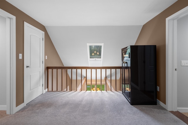 11 Sledding Hill Ln, Lee, NH 03861 - hall with carpet flooring, vaulted ceiling, and baseboards