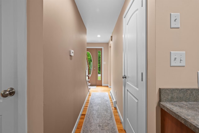 11 Sledding Hill Ln, Lee, NH 03861 - corridor with light wood-type flooring, a baseboard heating unit, baseboards, and recessed lighting
