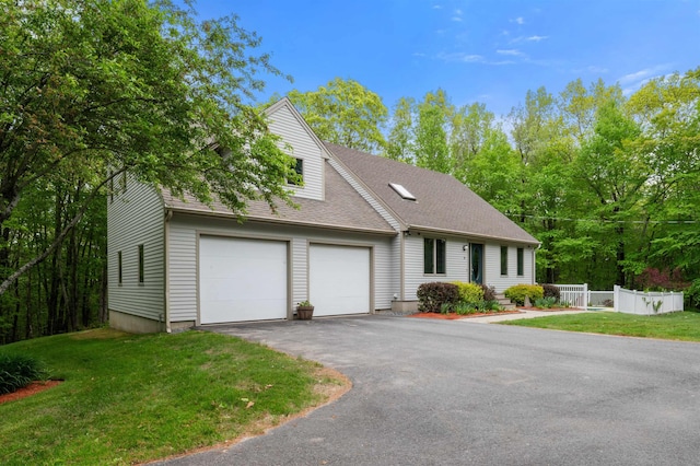 11 Sledding Hill Ln, Lee, NH 03861 - view of front of property with an attached garage, asphalt driveway, and roof with shingles