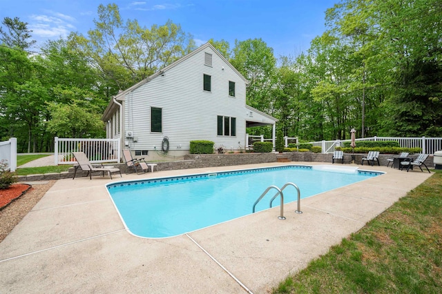 11 Sledding Hill Ln, Lee, NH 03861 - swimming pool featuring a patio area and view of wooded area