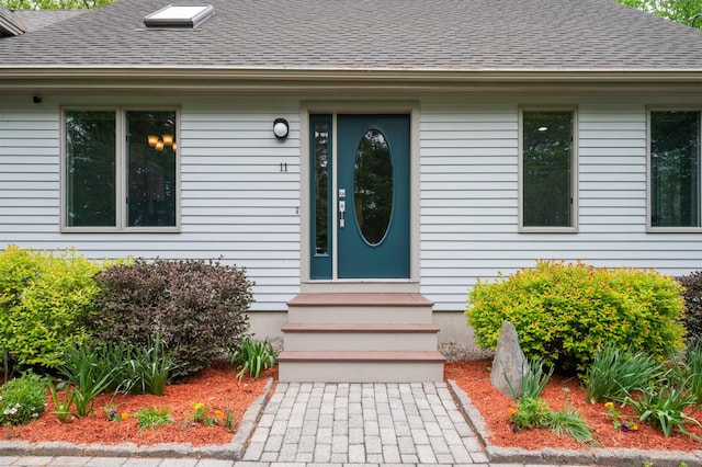 11 Sledding Hill Ln, Lee, NH 03861 - view of exterior entry featuring roof with shingles