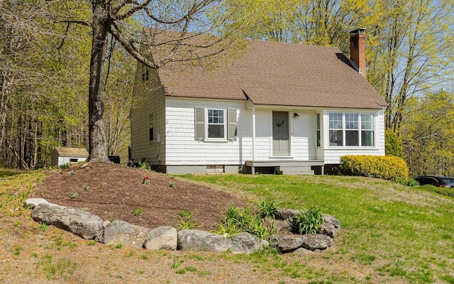 66 Lookout Hill Rd, Peterborough, NH 03458 - view of front facade with a chimney, a shingled roof, and a front lawn