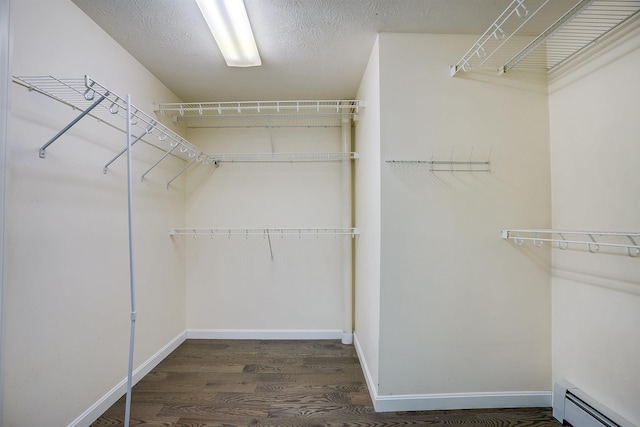 185 Whitford St, Manchester, NH 03104 - walk in closet featuring a baseboard radiator and wood finished floors