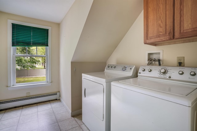 185 Whitford St, Manchester, NH 03104 - washroom featuring a baseboard heating unit, cabinet space, washer and dryer, baseboards, and light tile patterned floors