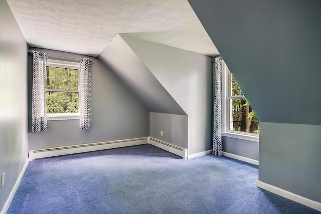 185 Whitford St, Manchester, NH 03104 - additional living space with vaulted ceiling, carpet floors, baseboards, a textured ceiling, and baseboard heating