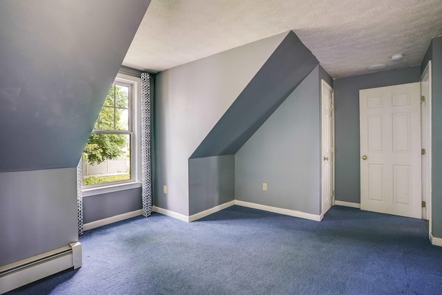 185 Whitford St, Manchester, NH 03104 - bonus room featuring baseboard heating, baseboards, carpet floors, and a textured ceiling