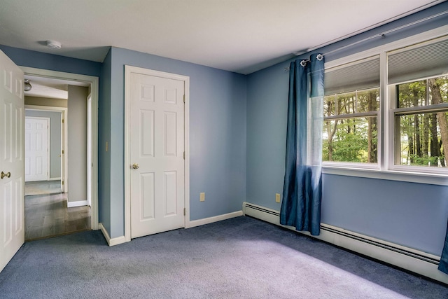 185 Whitford St, Manchester, NH 03104 - unfurnished bedroom featuring baseboard heating, carpet flooring, and baseboards