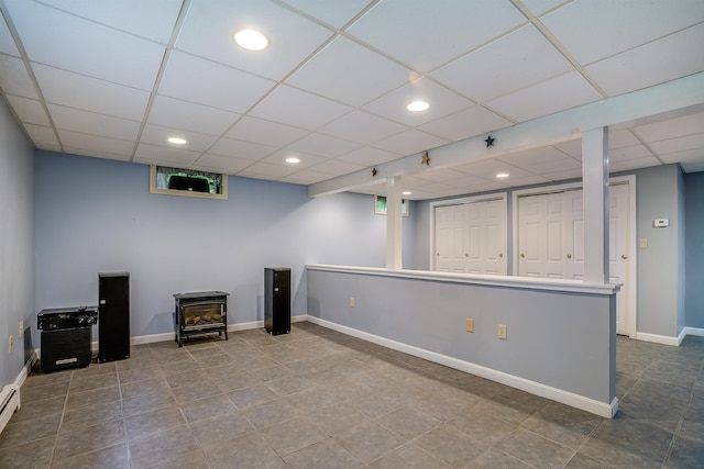 185 Whitford St, Manchester, NH 03104 - below grade area featuring a drop ceiling, recessed lighting, baseboards, tile patterned floors, and a baseboard heating unit
