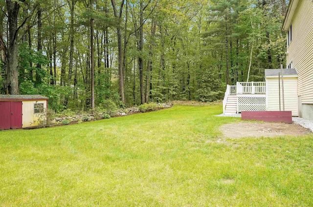 185 Whitford St, Manchester, NH 03104 - view of grassy yard with stairs, a deck, and a wooded view