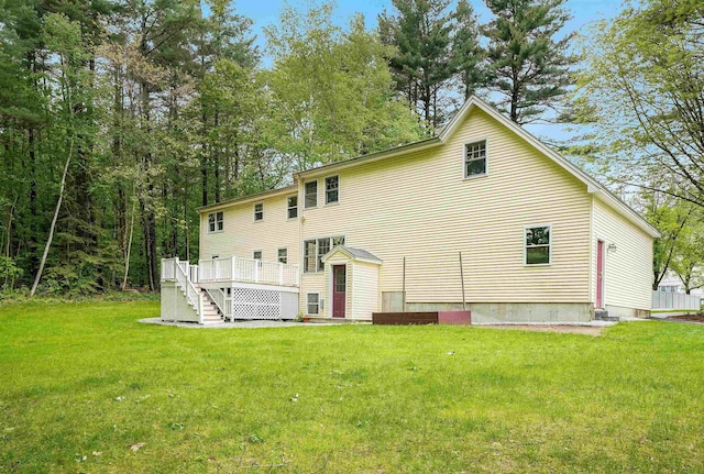 185 Whitford St, Manchester, NH 03104 - back of property featuring a yard, a wooden deck, and stairs