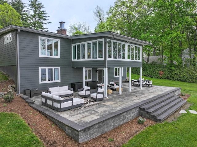 28 Woodvue Rd, Windham, NH 03087 - back of property with outdoor lounge area, a chimney, a patio area, and a yard