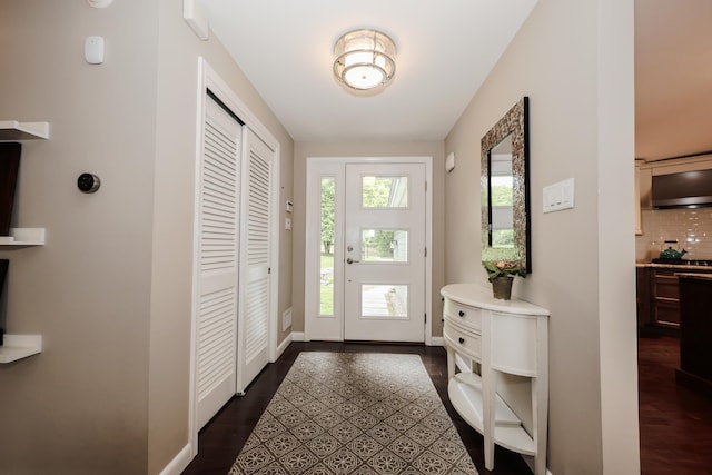 28 Woodvue Rd, Windham, NH 03087 - foyer with dark wood-style flooring and baseboards