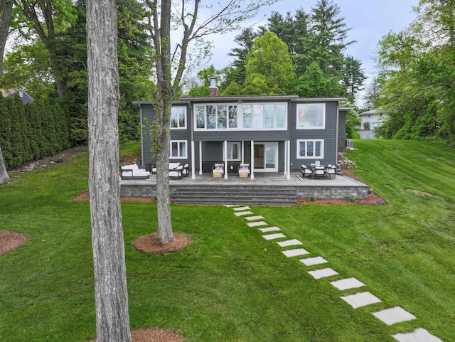 28 Woodvue Rd, Windham, NH 03087 - rear view of property featuring a patio area, a yard, an outdoor hangout area, and a chimney