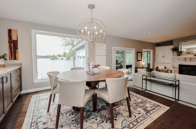 28 Woodvue Rd, Windham, NH 03087 - dining area with dark wood-type flooring, a chandelier, plenty of natural light, and recessed lighting