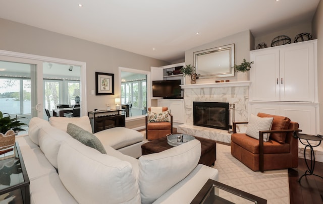 28 Woodvue Rd, Windham, NH 03087 - living room featuring a premium fireplace, vaulted ceiling, and recessed lighting
