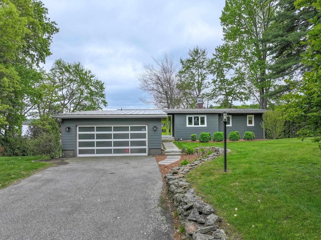 28 Woodvue Rd, Windham, NH 03087 - view of front facade with a front yard and a chimney
