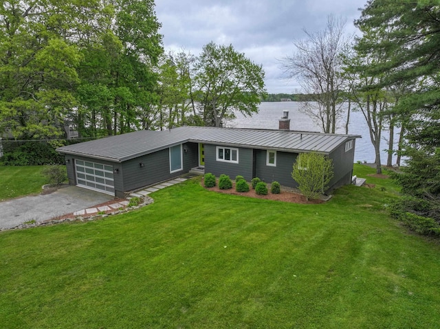 28 Woodvue Rd, Windham, NH 03087 - view of front of property featuring a chimney, a standing seam roof, metal roof, a water view, and asphalt driveway
