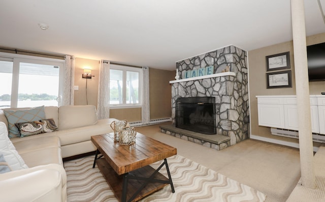 28 Woodvue Rd, Windham, NH 03087 - carpeted living room featuring a baseboard radiator, a stone fireplace, and baseboards
