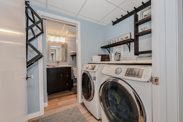 28 Woodvue Rd, Windham, NH 03087 - washroom with washing machine and dryer, light wood-type flooring, and baseboards