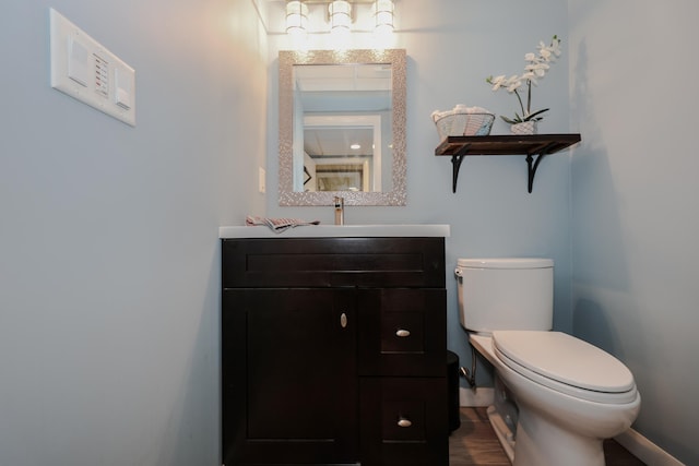 28 Woodvue Rd, Windham, NH 03087 - bathroom with toilet, baseboards, and vanity