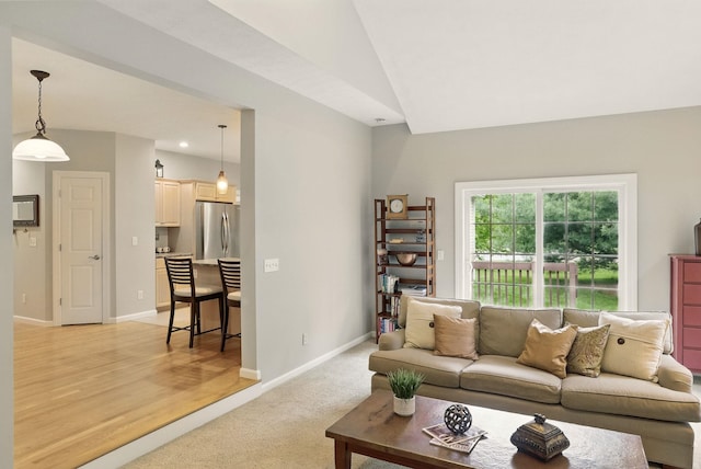 9 Swenson Rd, Bedford, NH 03110 - living area featuring light carpet, baseboards, vaulted ceiling, and recessed lighting