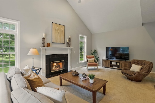 9 Swenson Rd, Bedford, NH 03110 - carpeted living area featuring high vaulted ceiling, plenty of natural light, a fireplace, and baseboards