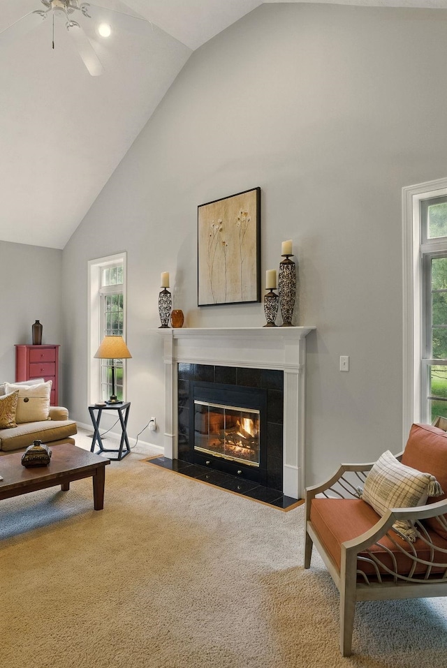 9 Swenson Rd, Bedford, NH 03110 - carpeted living area with a tiled fireplace, high vaulted ceiling, and a ceiling fan