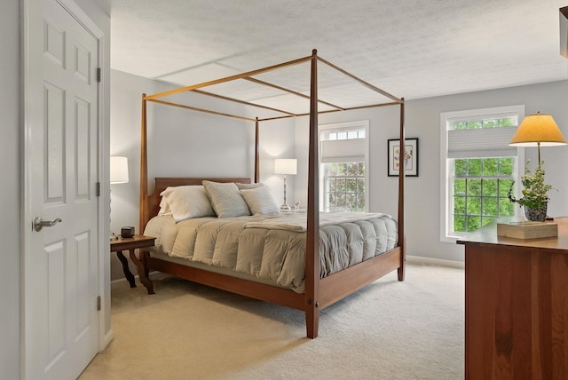 9 Swenson Rd, Bedford, NH 03110 - bedroom featuring light colored carpet, a textured ceiling, and baseboards