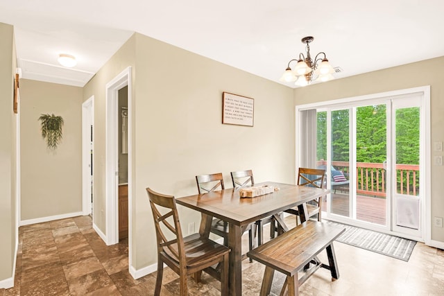 1191 Beech Ridge Rd, North Berwick, ME 03906 - dining area with baseboards and a chandelier
