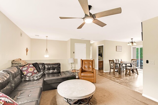 1191 Beech Ridge Rd, North Berwick, ME 03906 - carpeted living room with ceiling fan, a chandelier, and baseboards