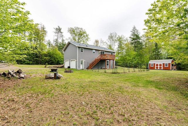 1191 Beech Ridge Rd, North Berwick, ME 03906 - view of yard featuring stairway, a deck, an attached garage, and view of wooded area