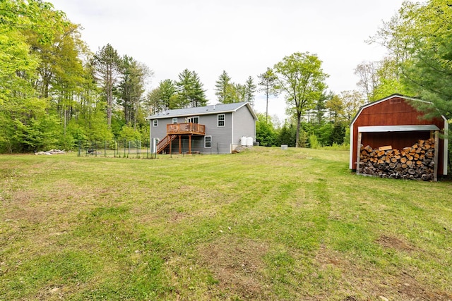 1191 Beech Ridge Rd, North Berwick, ME 03906 - view of green lawn with stairway, a wooden deck, and an outdoor structure