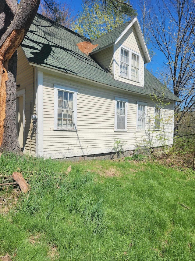 1428 Monroe Rd, Littleton, NH 03561 - view of side of home with roof with shingles and a yard
