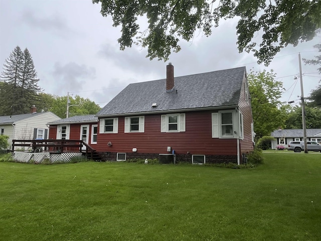 14 Brierwood Ln, Burlington, VT 05408 - rear view of property with a chimney, a lawn, a wooden deck, cooling unit, and roof with shingles