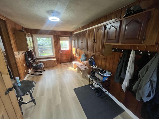 14 Brierwood Ln, Burlington, VT 05408 - mudroom with wooden walls, light wood-style flooring, and a textured ceiling