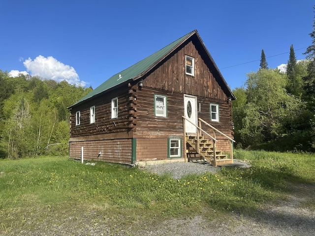3342 E Hill Rd, Wolcott, VT 05680 - view of property exterior featuring log siding
