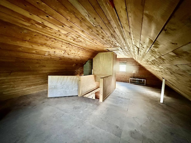 3342 E Hill Rd, Wolcott, VT 05680 - bonus room featuring unfinished concrete floors, vaulted ceiling, wood ceiling, and wood walls