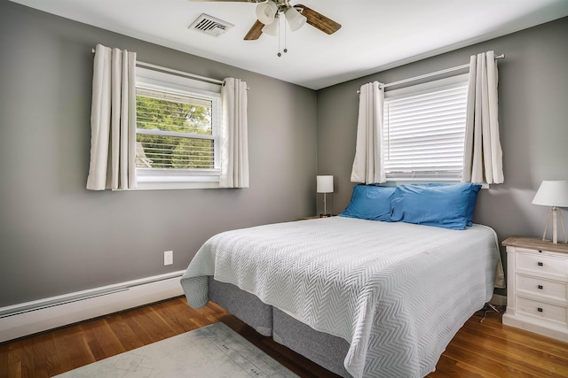 104 Lodge St, Manchester, NH 03104 - bedroom with a baseboard radiator, wood finished floors, and ceiling fan