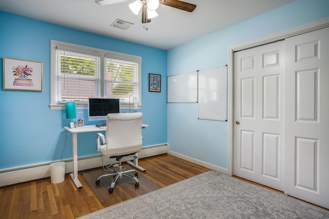 104 Lodge St, Manchester, NH 03104 - home office with a ceiling fan, wood finished floors, and baseboards