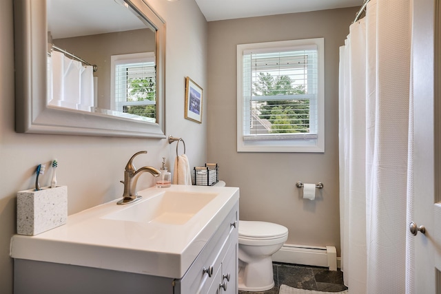 104 Lodge St, Manchester, NH 03104 - bathroom featuring baseboard heating, vanity, and toilet